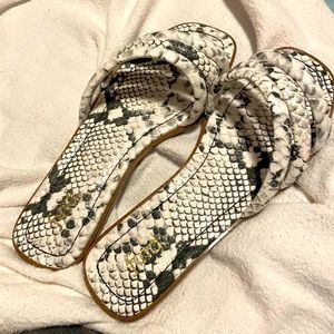 Black and white snake skin flats.